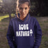 Person wearing a navy hoodie with 'Love Nature' text in an outdoor setting
