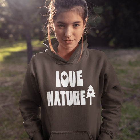 Woman wearing a hoodie with 'Love Nature' text in an outdoor setting