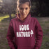 Person wearing a maroon hoodie with 'Love Nature' text in a natural setting