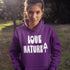 Person wearing a purple hoodie with 'LOVE NATURE' text in a natural setting