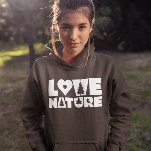 Woman wearing a hoodie with 'Love Nature' text in a natural setting