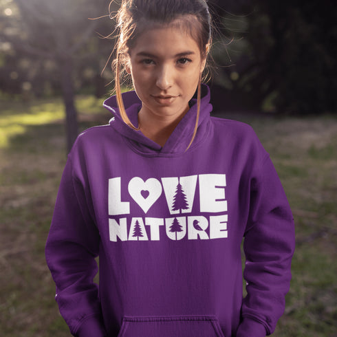 Person wearing a purple hoodie with 'LOVE NATURE' text in a natural setting