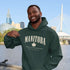 Manitoba Rooted in the Heartland hoodie with maple leaf and vintage collegiate lettering on a unisex Gildan sweatshirt