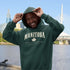 Manitoba Rooted in the Heartland hoodie with maple leaf and vintage collegiate lettering on a unisex Gildan sweatshirt