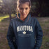 Manitoba Rooted in the Heartland hoodie with maple leaf and vintage collegiate lettering on a unisex Gildan sweatshirt