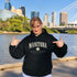 Manitoba Rooted in the Heartland hoodie with maple leaf and vintage collegiate lettering on a unisex Gildan sweatshirt