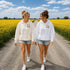 Vintage-inspired Manitoba prairie hoodie featuring a matching left chest design and oversized back graphic displayed on a unisex hoodie lifestyle mockup in an outdoor prairie setting. Available in multiple hoodie colors.