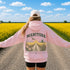Vintage-inspired Manitoba prairie hoodie featuring a matching left chest design and oversized back graphic displayed on a unisex hoodie lifestyle mockup in an outdoor prairie setting. Available in multiple hoodie colors.