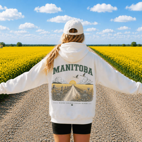 Vintage-inspired Manitoba prairie hoodie featuring a matching left chest design and oversized back graphic displayed on a unisex hoodie lifestyle mockup in an outdoor prairie setting. Available in multiple hoodie colors.