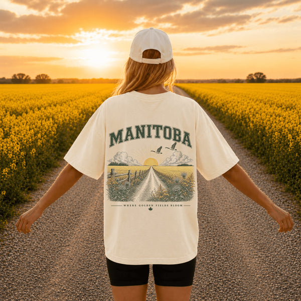 Person wearing a Comfort Colors 1717 unisex graphic t-shirt featuring a coordinating left chest print and a large vintage-inspired back design in an outdoor nature setting. Available in multiple colours with lifestyle and flat lay mockups.