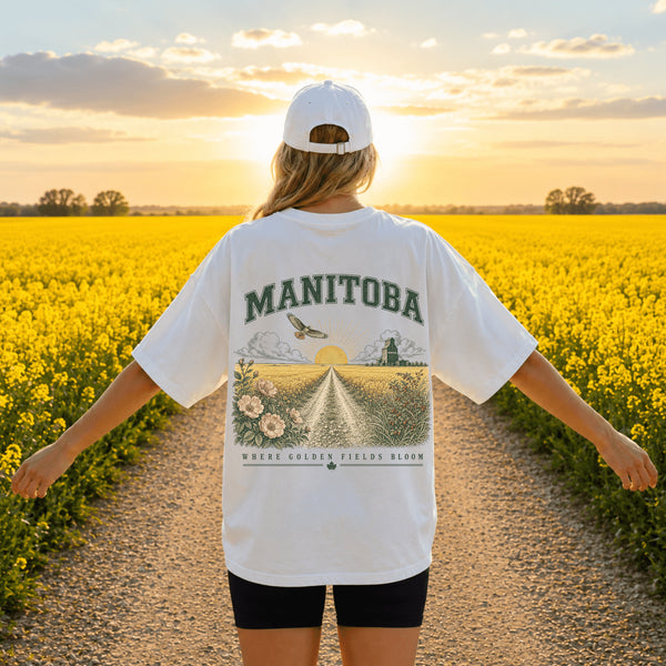 Person wearing a Comfort Colors® 1717 unisex graphic t-shirt featuring a coordinating left chest print and a large vintage-inspired back design in an outdoor lifestyle setting. Available in multiple colours with lifestyle, flat lay, and folded mockups.