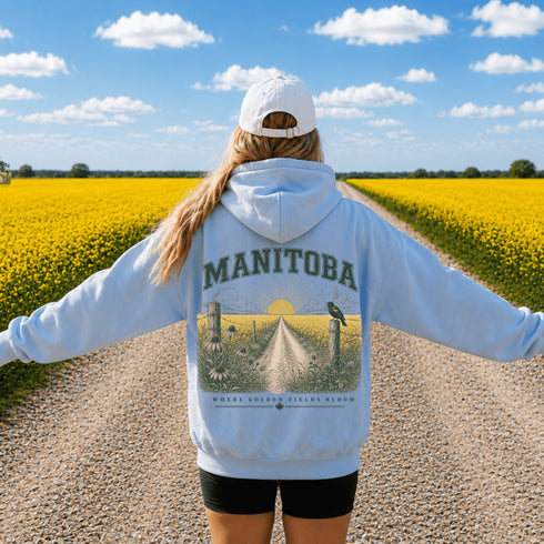 Vintage-inspired Manitoba prairie hoodie featuring a matching left chest design and oversized back graphic shown on a unisex hoodie lifestyle mockup with outdoor-inspired accessories. Available in multiple hoodie colors.