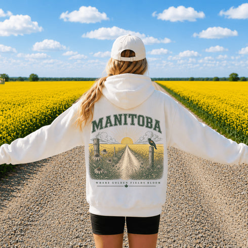 Vintage-inspired Manitoba prairie hoodie featuring a matching left chest design and oversized back graphic shown on a folded unisex hoodie lifestyle mockup with outdoor-inspired accessories. Available in multiple hoodie colors.