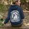Featuring a bold bear graphic surrounded by pine trees and a crescent moon, this hoodie captures everything we love about Manitoba’s wild landscape.
