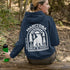 This cozy hoodie features a bold graphic of a bear surrounded by pine trees and rising sun—capturing the spirit of Manitoba’s rugged landscapes and Prairie Life culture.