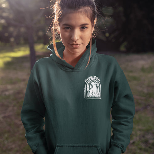 This cozy hoodie features a bold graphic of a bear surrounded by pine trees and rising sun—capturing the spirit of Manitoba’s rugged landscapes and Prairie Life culture.