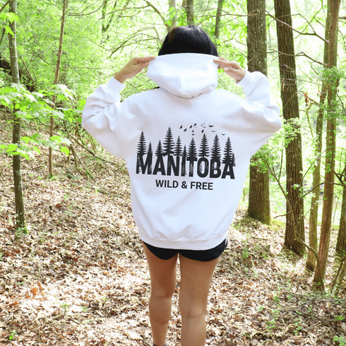 This striking design showcases a serene forest scene that reflects the natural charm and rugged landscapes of Manitoba.