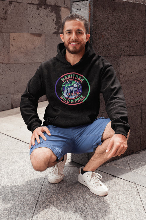 Unleash your wild side with our Manitoba – Wild & Free hoodie, featuring an enchanting graphic of an arctic fox beneath the dazzling northern lights.
