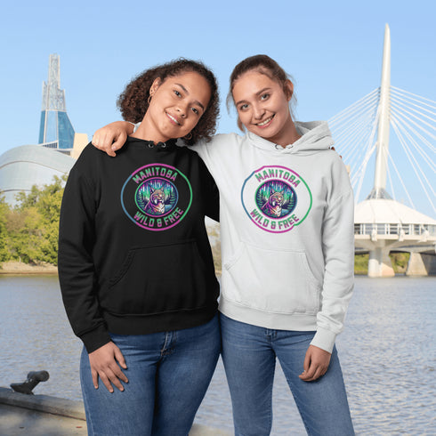 Step into the wild with our Manitoba – Wild & Free hoodie, featuring a striking graphic of a lynx under the glow of the northern lights.