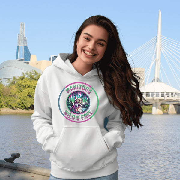 Step into the wild with our Manitoba – Wild & Free hoodie, featuring a striking graphic of a lynx under the glow of the northern lights.