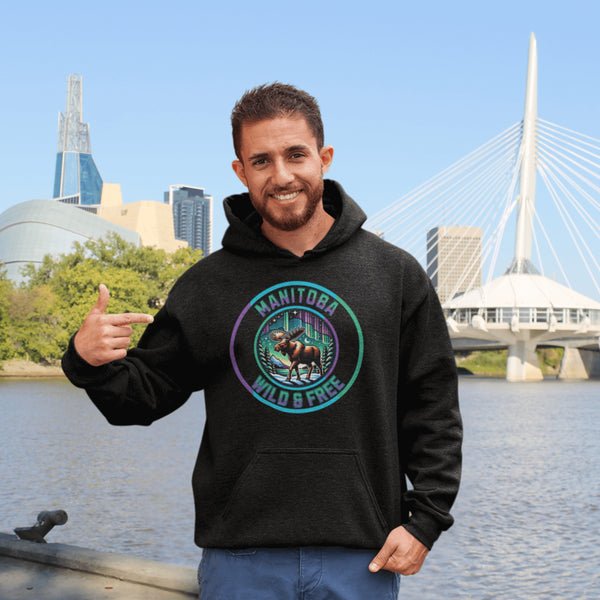 Step into the wild with our Manitoba – Wild & Free hoodie, featuring a majestic moose silhouetted against the breathtaking northern lights.