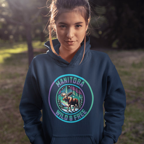 Step into the wild with our Manitoba – Wild & Free hoodie, featuring a majestic moose silhouetted against the breathtaking northern lights.