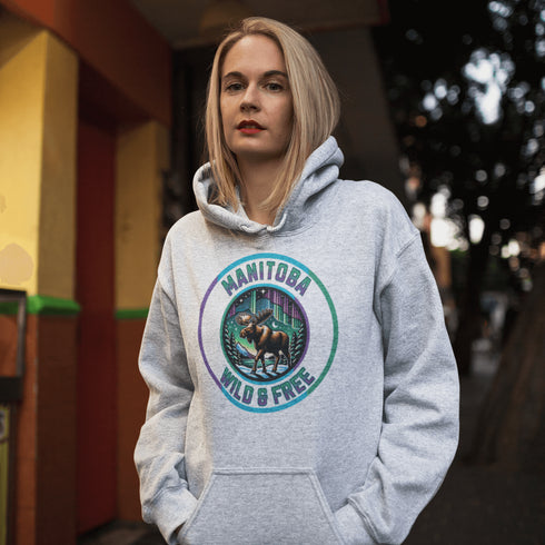 Step into the wild with our Manitoba – Wild & Free hoodie, featuring a majestic moose silhouetted against the breathtaking northern lights.