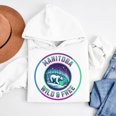 Embrace the power and beauty of the north with our Manitoba – Wild & Free hoodie, featuring a bold graphic of a polar bear beneath the awe-inspiring northern lights.