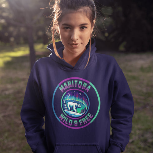 Embrace the power and beauty of the north with our Manitoba – Wild & Free hoodie, featuring a bold graphic of a polar bear beneath the awe-inspiring northern lights.