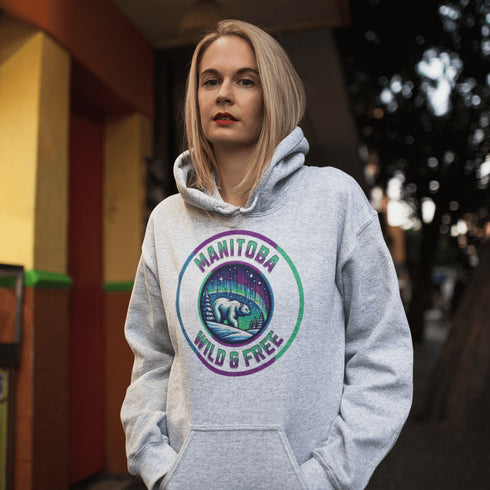 Embrace the power and beauty of the north with our Manitoba – Wild & Free hoodie, featuring a bold graphic of a polar bear beneath the awe-inspiring northern lights.