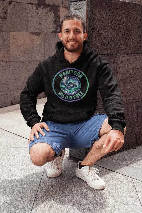 Embrace the magic of the prairies with our Manitoba – Wild & Free hoodie, featuring a captivating graphic of a snowy owl in flight beneath the shimmering northern lights.