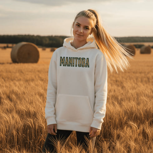 Stay cozy and stylish with this Manitoba-themed hoodie featuring the letters filled with wheat. Perfect for anyone looking for a cozy hoodie to wear during winter.