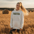 Stay cozy and stylish with this Manitoba-themed hoodie featuring the letters filled with wheat. Perfect for anyone looking for a cozy hoodie to wear during winter.
