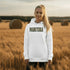 Stay cozy and stylish with this Manitoba-themed hoodie featuring the letters filled with wheat. Perfect for anyone looking for a cozy hoodie to wear during winter.