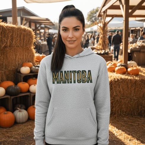 Stay cozy and stylish with this Manitoba-themed hoodie featuring the letters filled with wheat. Perfect for anyone looking for a cozy hoodie to wear during winter.