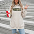 Stay cozy and stylish with this Manitoba-themed hoodie featuring the letters filled with wheat. Perfect for anyone looking for a cozy hoodie to wear during winter.