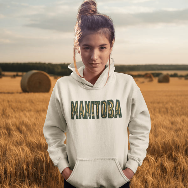 Stay cozy and stylish with this Manitoba-themed hoodie featuring the letters filled with wheat. Perfect for anyone looking for a cozy hoodie to wear during winter.