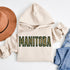 Stay cozy and stylish with this Manitoba-themed hoodie featuring the letters filled with wheat. Perfect for anyone looking for a cozy hoodie to wear during winter.