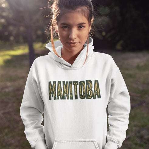 Stay cozy and stylish with this Manitoba-themed hoodie featuring the letters filled with wheat. Perfect for anyone looking for a cozy hoodie to wear during winter.