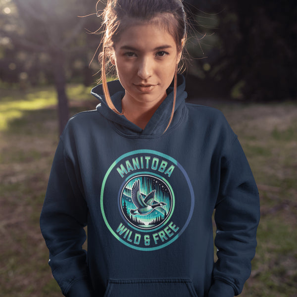 Embrace the spirit of the prairies with our Manitoba – Wild & Free hoodie, featuring a stunning graphic of a Canadian goose in flight beneath the mesmerizing northern lights.
