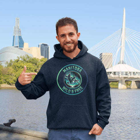Embrace the spirit of the prairies with our Manitoba – Wild & Free hoodie, featuring a stunning graphic of a Canadian goose in flight beneath the mesmerizing northern lights.