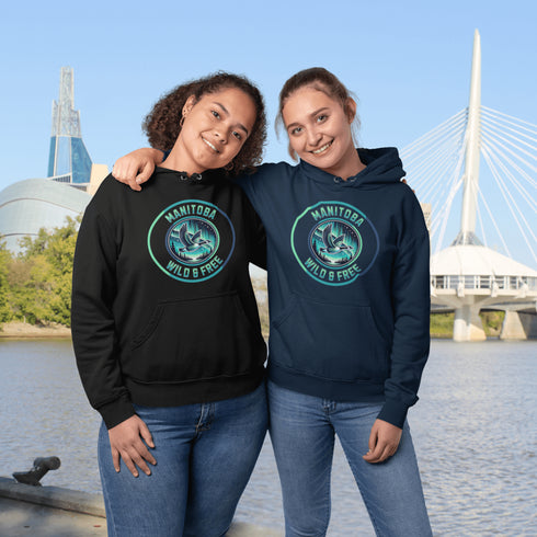 Embrace the spirit of the prairies with our Manitoba – Wild & Free hoodie, featuring a stunning graphic of a Canadian goose in flight beneath the mesmerizing northern lights.