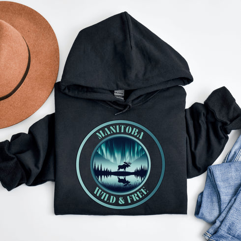 This hoodie brings the heart of Manitoba’s wilderness to life, featuring a majestic moose under the breathtaking glow of the Northern Lights.