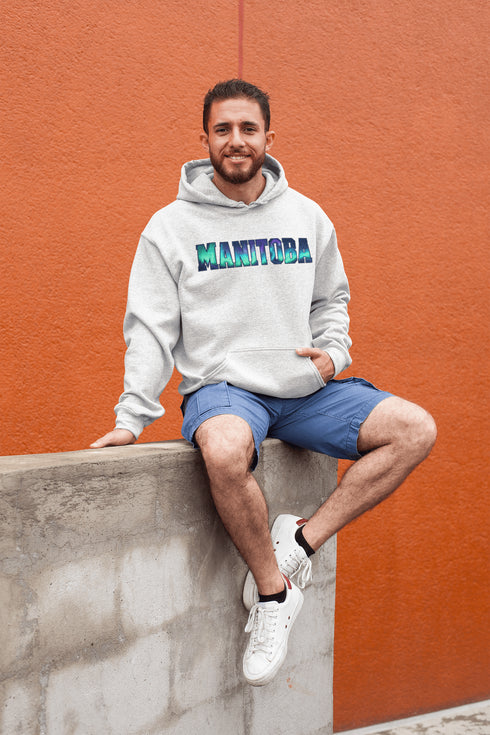 Our Manitoba Northern Lights Hoodie features the province’s name in a stunning aurora-inspired font that shimmers with the spirit of the North.