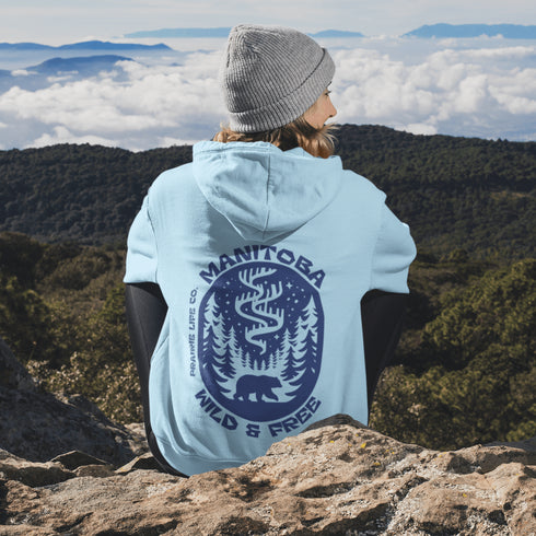 Wrap yourself in cozy prairie vibes with this beautifully designed Manitoba “Wild & Free” hoodie.