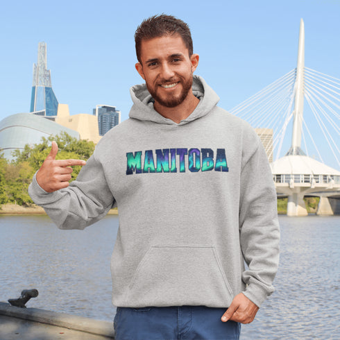 Our Manitoba Northern Lights Hoodie features the province’s name in a stunning aurora-inspired font that shimmers with the spirit of the North.