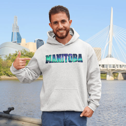 Our Manitoba Northern Lights Hoodie features the province’s name in a stunning aurora-inspired font that shimmers with the spirit of the North.