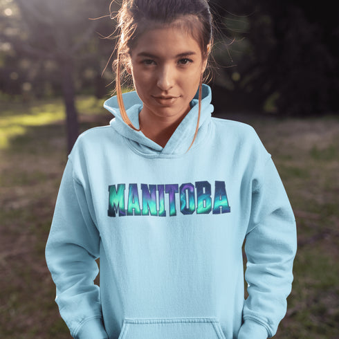 Our Manitoba Northern Lights Hoodie features the province’s name in a stunning aurora-inspired font that shimmers with the spirit of the North.