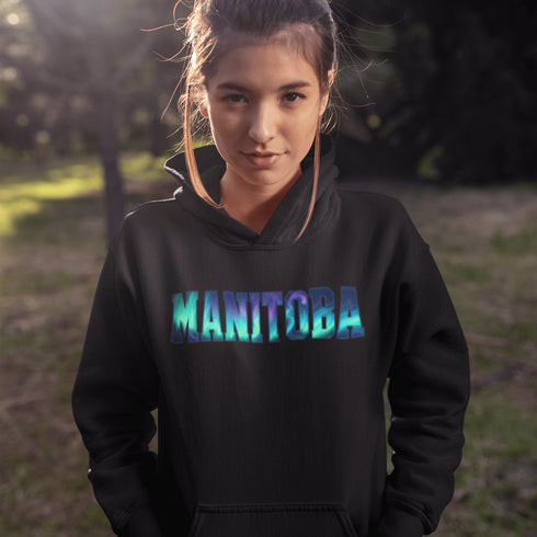 Our Manitoba Northern Lights Hoodie features the province’s name in a stunning aurora-inspired font that shimmers with the spirit of the North.