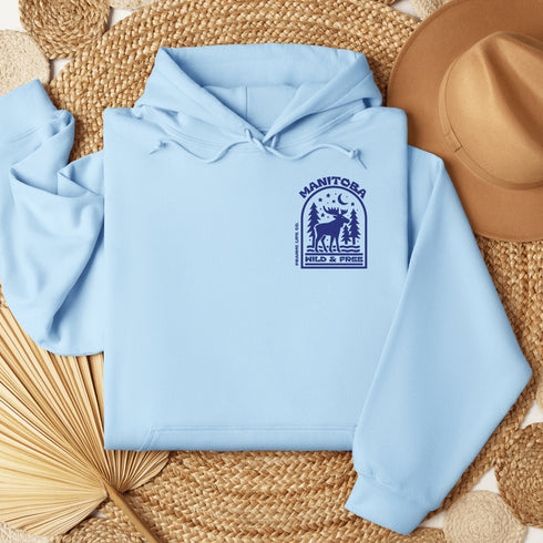 This Manitoba hoodie captures the beauty of Canada’s backcountry with a moose silhouette surrounded by starlit skies, tall evergreens, and a crescent moon.